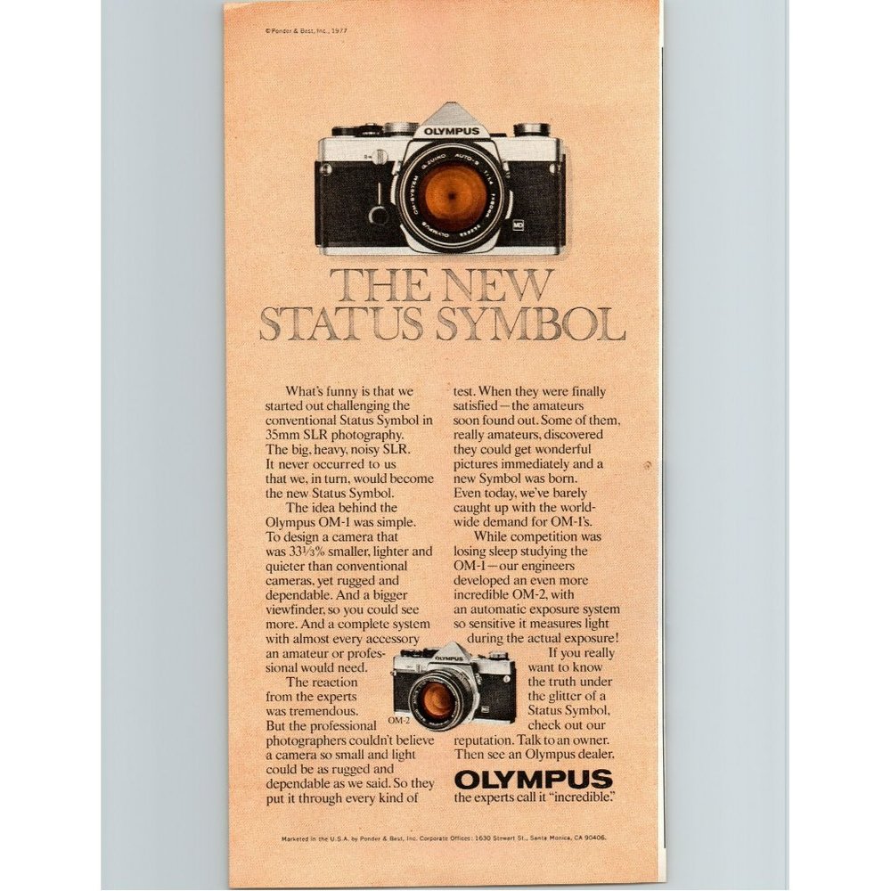 1977 Olympus OM-1 SLR 35mm Film Camera Vintage Print Ad The New Status Symbol